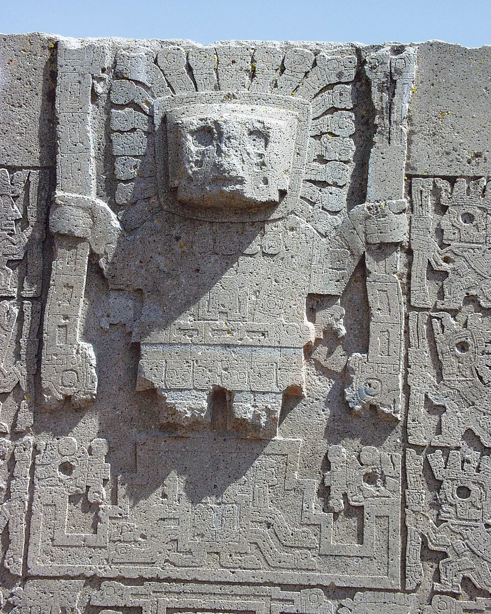 A detail of the Gate of the Sun at Tiwanaku, Bolivia, showing its central figure and surrounding imagery.