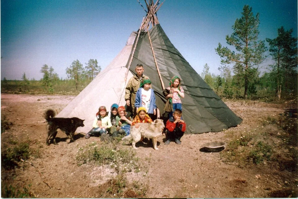 Khanty people beside a chum near Lake Numto, a sacred lake in Khanty tradition.